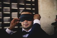 Blindfolded groom