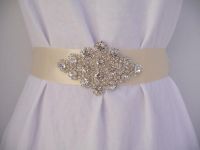 Queen's Lace Genuine Crystal Rhinestone Bridal Sash all hand sewn onto your choice of Ivory or White satin.  Accentuate your waistline and create a sleek figure with this unique Bridal Sash.  Buy at www.BellaCescaBoutique.Etsy.com