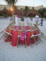 Coral Linen, Pink runner and orange napkins also tiffany chairs  in golden color ...the wind was tricky but we did it!!