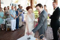 We had a simple 20-minute ceremony. In lieu of a sand ceremony we opted for a "stone ceremony". We brought glass stones with us and had them in a basket, each guest took one when getting seated for the wedding. Then, during the wedding we invited each of 
