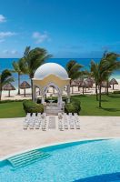 www.crystalwaterweddings.com Experienced travel agents who strongly value providing first class service and have a deep passion for destination weddings.  Secrets Capri Riviera Cancun 
Wedding ceremony is set-up at the gazebo with the Caribbean as the ba